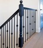 Antique inspired wood and wrought iron staircase