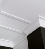 White casing along the ceiling with moulding