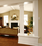 Light beige walls with white moulding and columns in a living room