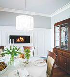 Dining room with light grey walls and white crown along the top